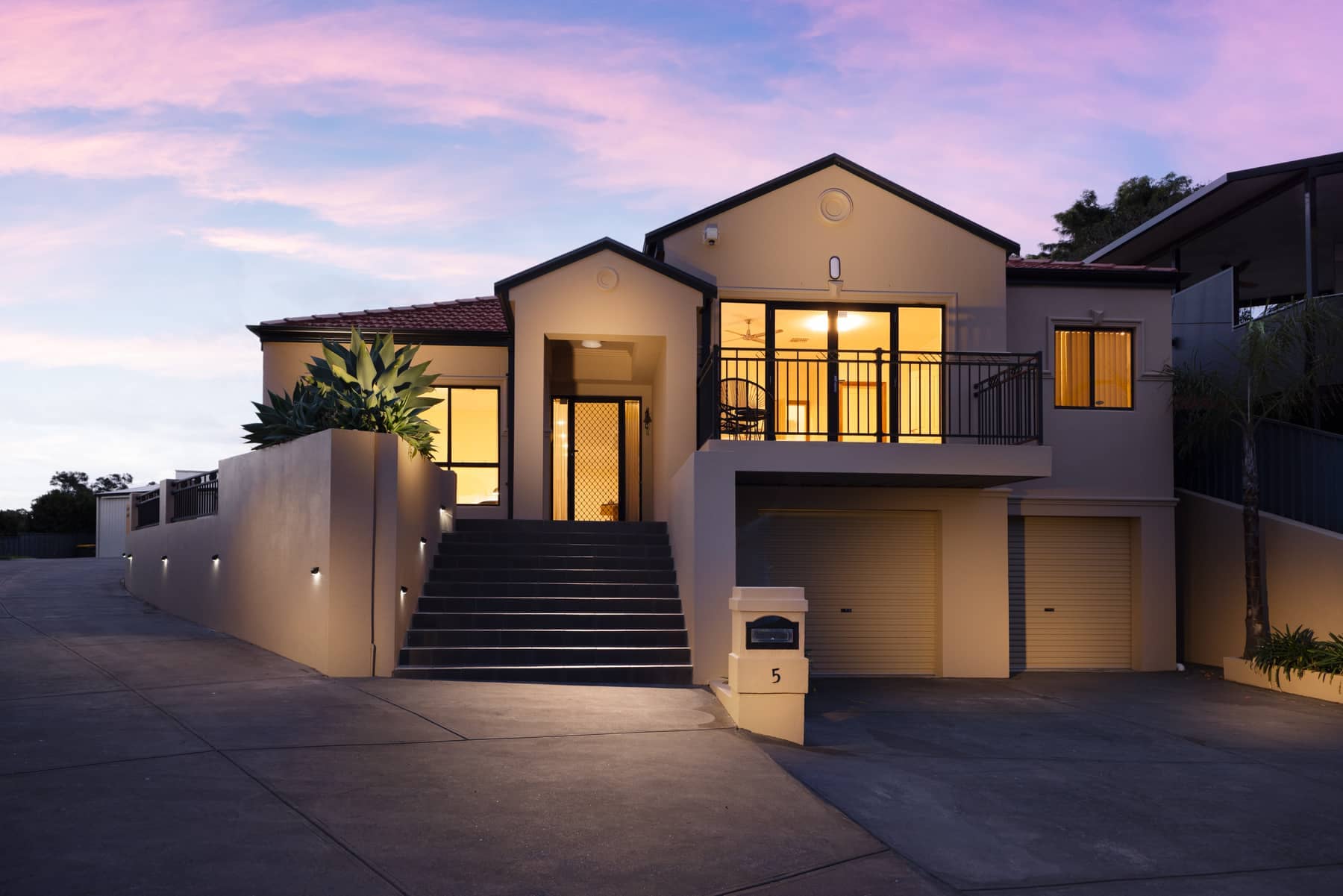Two-storey home glowing at twilight — 5 Welkin Court, Adelaide
